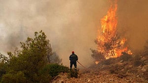 Wildfire rages outside Athens