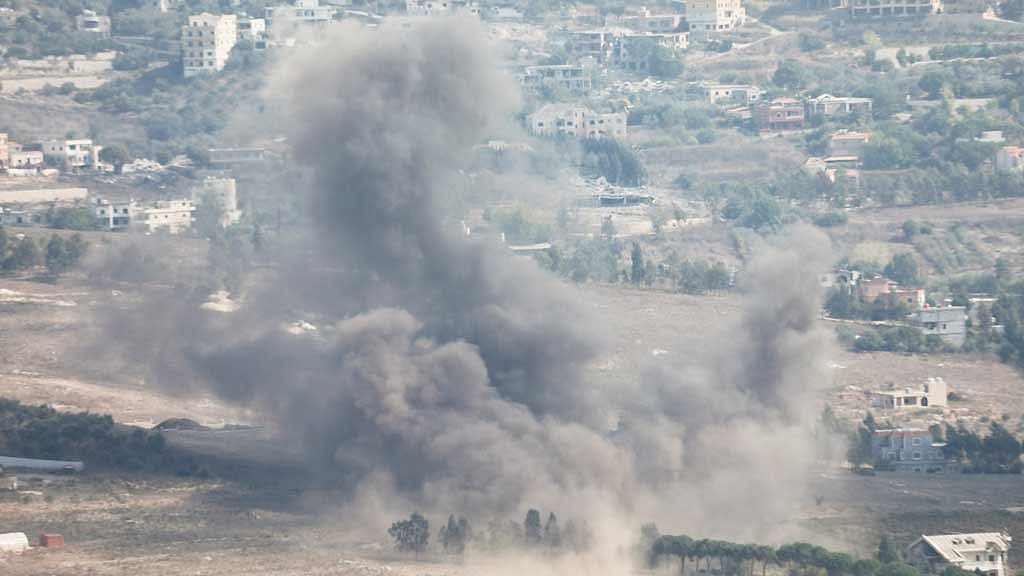 Smoke billows over Khiam, amid ongoing hostilities between Hezbollah and Israeli forces, as seen from Marjayoun, near the Lebanese border with Israel, Oct 13, 2024. REUTERS/Karamallah Daher