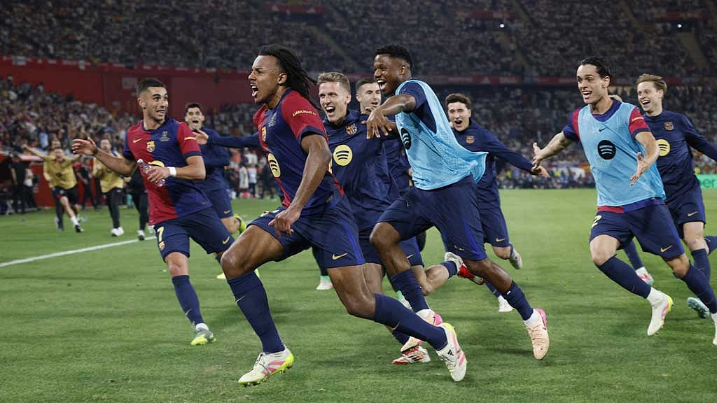 FC Barcelona v Real Madrid - Estadio de La Cartuja, Seville, Spain - April 27, 2025 FC Barcelona's Jules Kounde celebrates scoring their third goal with teammates REUTERS