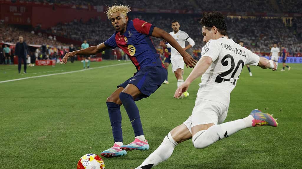 FC Barcelona v Real Madrid - Estadio de La Cartuja, Seville, Spain - April 26, 2025 Real Madrid's Fran Garcia in action with FC Barcelona's Lamine Yamal REUTERS