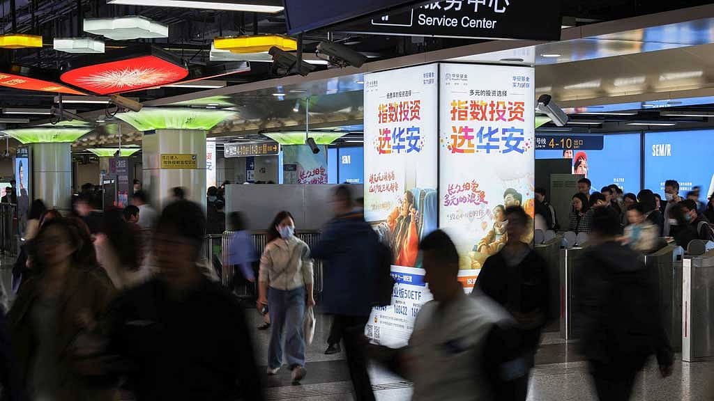 Commuters walk in a subway station at the Lujiazui financial district in Shanghai, China Apr 15, 2025. REUTERS/Go Nakamura
