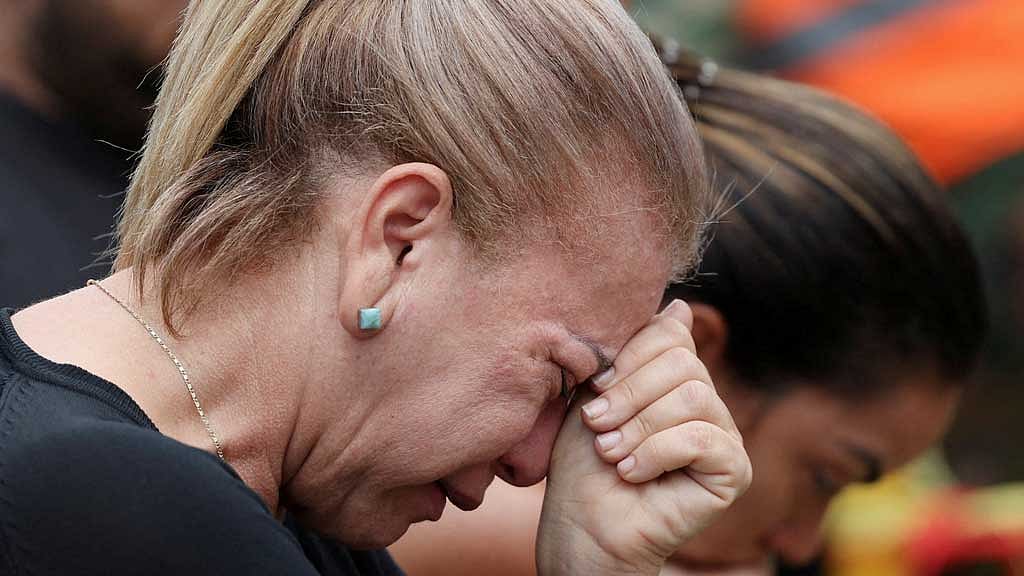 A relative of the victims reacts at the site of the collapsed Jet Set nightclub in Santo Domingo, Dominican Republic, Apr 9, 2025. REUTERS/Ricardo Arduengo