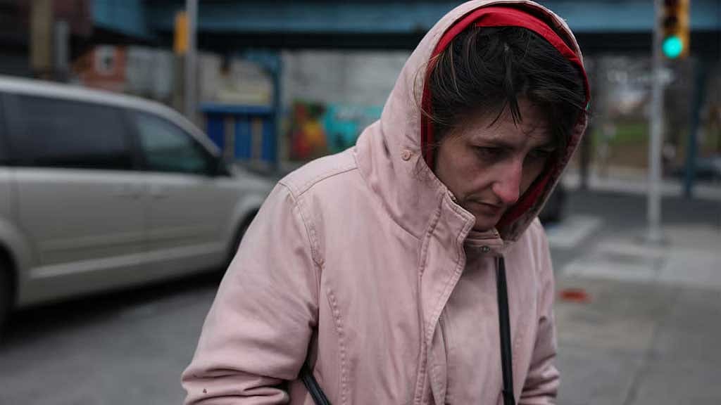 Nicole Didomenico, 28, who says she uses fentanyl, stands near a sidewalk food pantry in Philadelphia on March 26, 2025. She said she pays as little as $3 a bag for the drug. REUTERS/Shannon Stapleton
