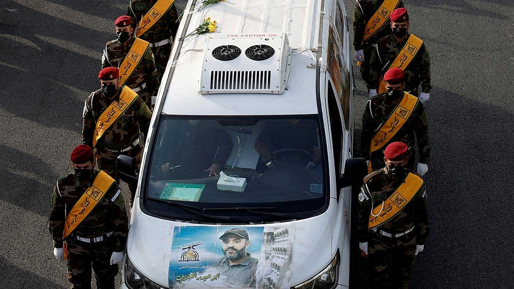 FILE PHOTO: A vehicle carries the coffin of a commander from Iraq's Kataib Hezbollah armed group who was killed in what they called a "Zionist attack" in the Syrian capital Damascus on Friday, during a funeral in Baghdad, Iraq September 22, 2024. REUTERS