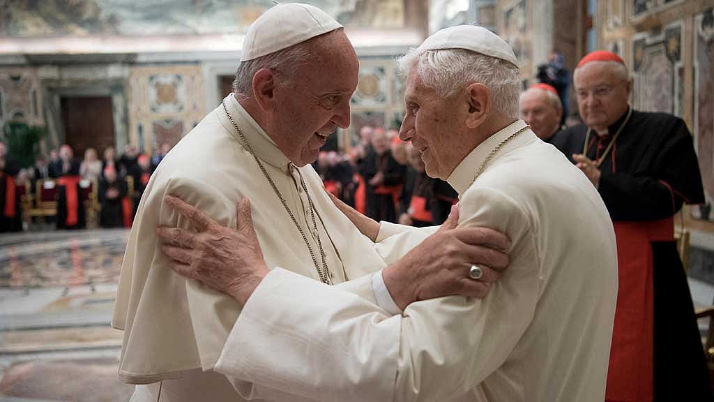 Former pope Benedict (R) is greeted by Pope Francis during a ceremony to mark his 65th anniversary of ordination to the priesthood at the Vatican June 28, 2016. Osservatore Romano/Vatican Media/Handout via Reuters