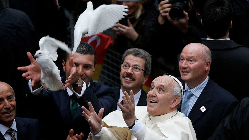 Pope Francis releases a white dove prior to delivering a Holy Mass at the Catholic Cathedral of the Holy Spirit in Istanbul November 29, 2014. REUTERS/Stoyan Nenov