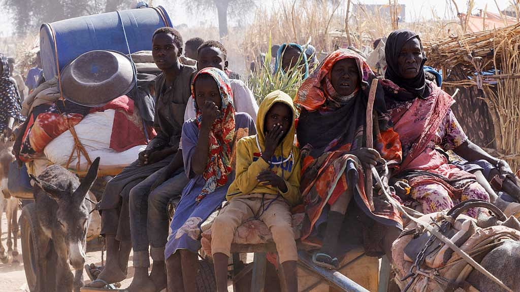 Displaced people ride an animal-drawn cart, following Rapid Support Forces (RSF) attacks on Zamzam displacement camp, in the town of Tawila, North Darfur, Sudan April 15, 2025. REUTERS