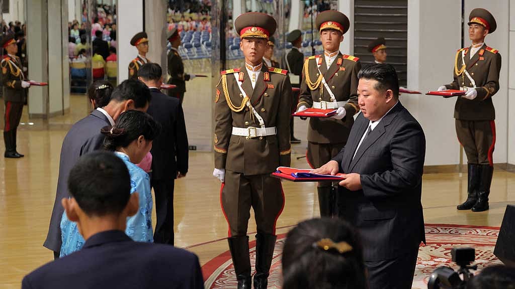 North Korean leader Kim Jong Un meets families of soldiers who participated in overseas military operations, in Pyongyang, North Korea, in this picture released by the Korean Central News Agency on August 30, 2025. KCNA via REUTERS
