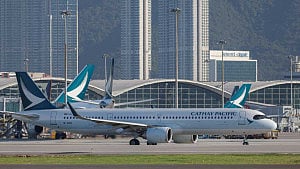Cathay passenger arrested for trying to open door mid-flight