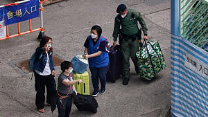 A week after Hong Kong fire, some residents return for belongings