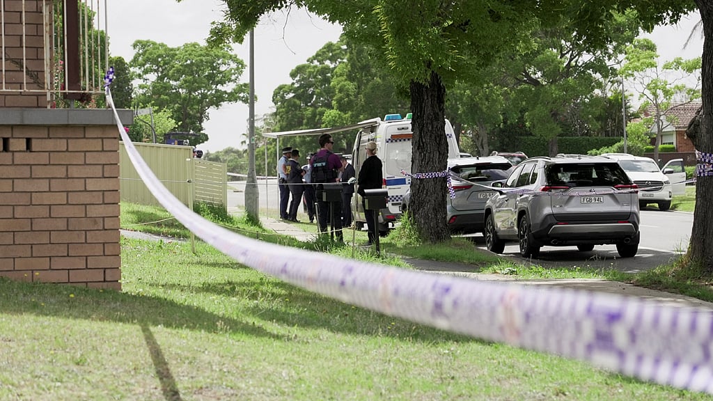 Police officers stand guard outside the house of the suspects of a shooting incident on a Jewish holiday celebration at Bondi Beach, in Bonnyrigg, Sydney, Australia, Dec 15, 2025. REUTERS/Alasdair Pal