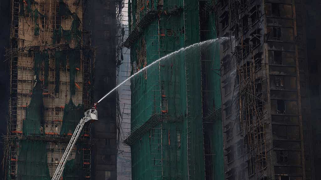 A general view shows the damaged towers at Wang Fuk Court housing complex following a deadly fire, in Tai Po, Hong Kong, China, Nov 27, 2025. REUTERS