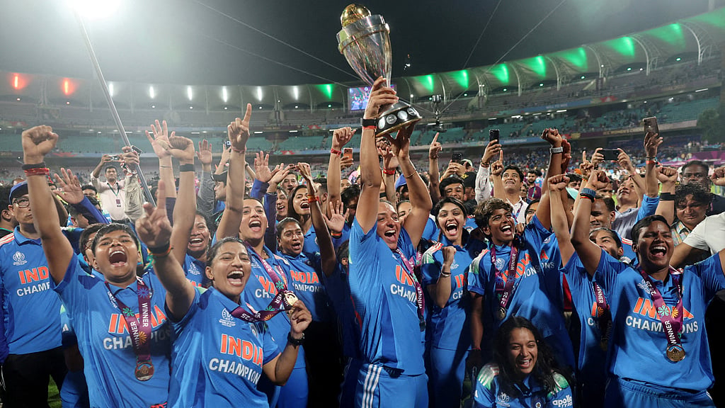 Cricket - ICC Women's World Cup - Final - India v South Africa - DY Patil Stadium, Navi Mumbai, India - Nov 2, 2025 India's Harmanpreet Kaur and teammates celebrate with the trophy after winning the ICC Women's World Cup. REUTERS