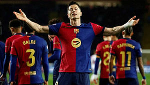Barcelona edge Rayo to claim top spot