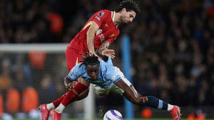Liverpool beat City to extend lead at top