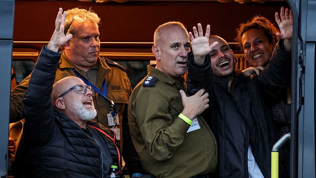 Omer Wenkert, a hostage who was held in Gaza since the deadly Oct 7, 2023 attack, waves after he was released from captivity as part of a hostages-prisoners swap and a ceasefire deal between Hamas and Israel, at Beilinson Schneider complex in Petah Tikva, Israel, Feb 22, 2025. REUTERS/Nir Elias