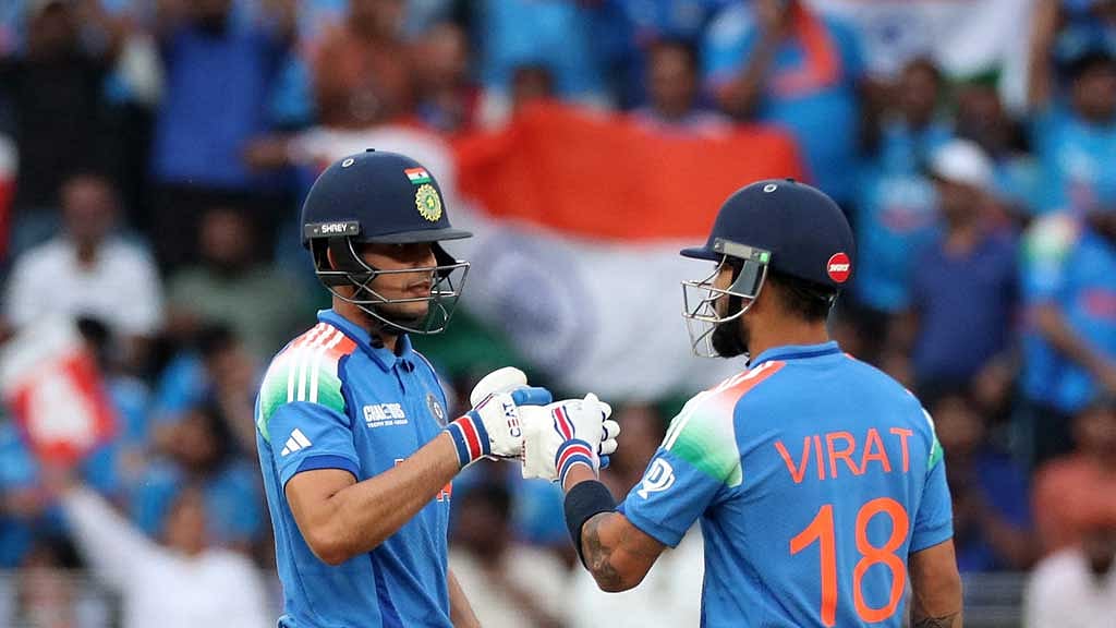 ICC Men's Champions Trophy - Group A - India v Pakistan - Dubai International Stadium, Dubai, United Arab Emirates - February 23, 2025 India's Shubman Gill bumps fists with Virat Kohli REUTERS/Satish Kumar
