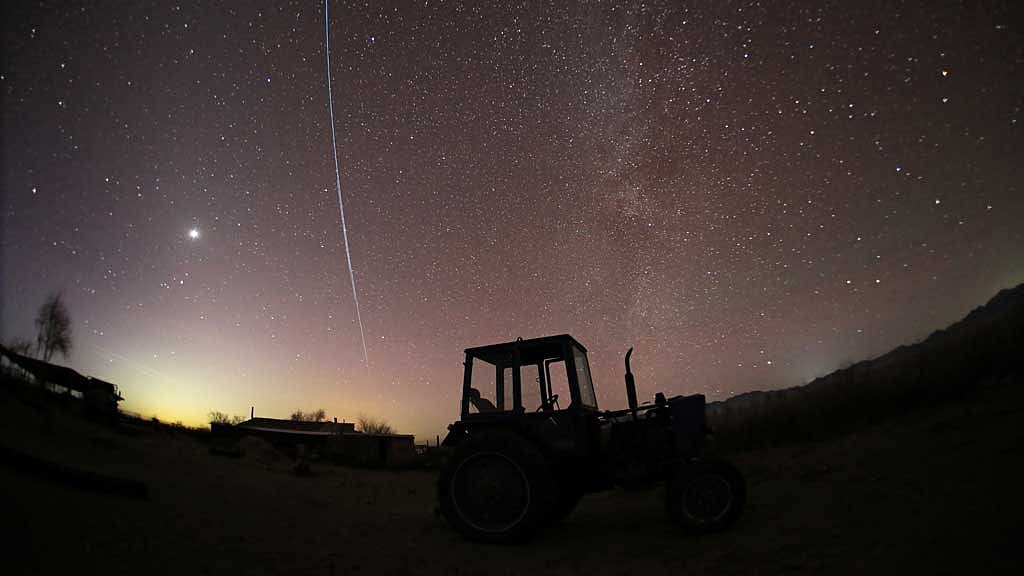 Starlink satellites are pictured in the sky over a farm in the Almaty Region, Kazakhstan Jan 25, 2025. REUTERS/Pavel Mikheyev