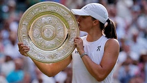Swiatek thrashes Anisimova to win Wimbledon title