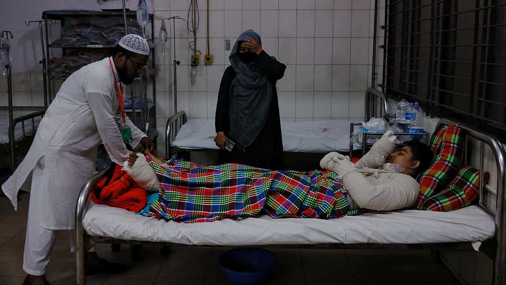 Raiyan, 14, a student, receives treatment at the Dhaka Medical College Hospital, after an air force training aircraft crashed into a building belonging to Milestone School and College, in Dhaka, Bangladesh, Jul 21, 2025. REUTERS/Mohammad Ponir Hossain