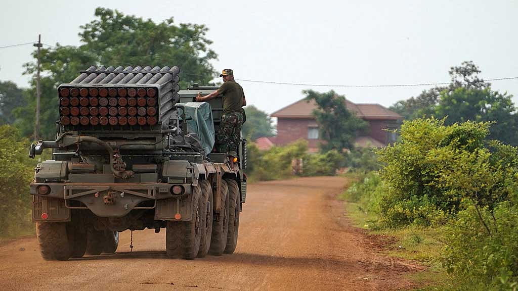 A Cambodian military personnel stands on a BM-21 Grad multiple rocket launcher, around 40 km (24 miles) from the disputed Ta Moan Thom temple, after Thailand and Cambodia exchanged heavy artillery on Friday as their worst fighting in more than a decade stretched for a second day, in Oddar Meanchey province, Cambodia, July 25, 2025. REUTERS