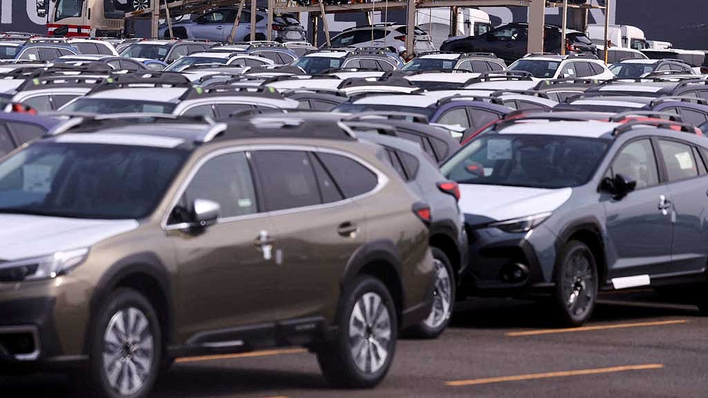 FILE PHOTO: FILE PHOTO: Newly manufactured cars awaiting export are parked at a port in Yokohama, south of Tokyo, Japan Mar 27, 2025. REUTERS/Issei Kato/File Photo/File Photo