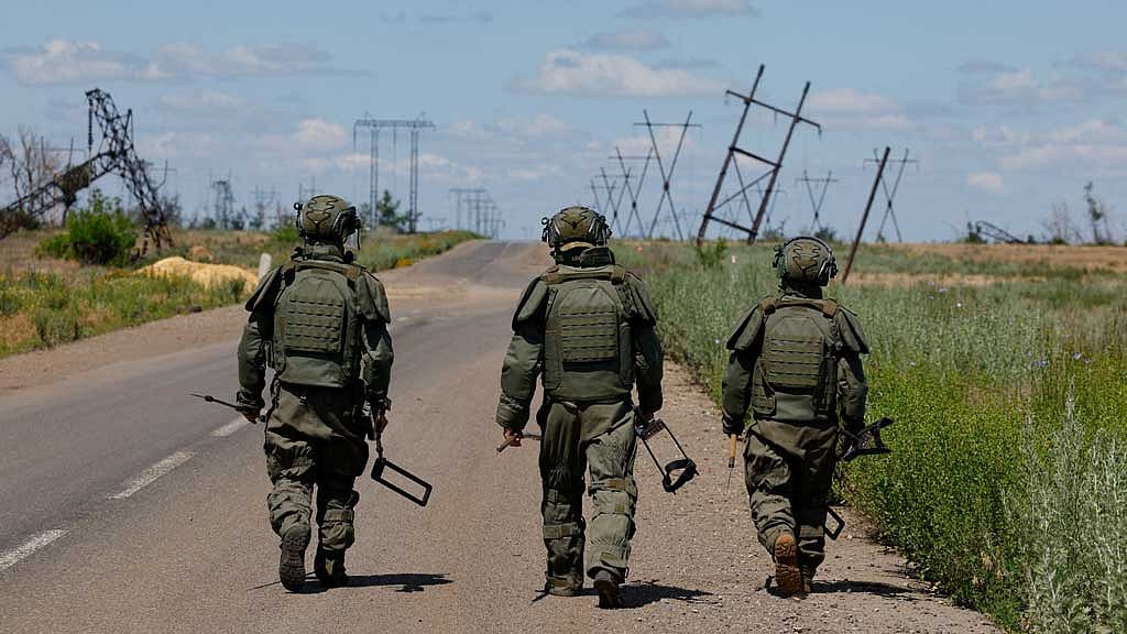 Sappers of the Russian armed forces walk along a motorway as they search for explosives and demine an area near the town of Marinka (Maryinka) in the course of Russia-Ukraine military conflict in the Donetsk region, a Russian-controlled territory of Ukraine, Jun 24, 2025. REUTERS/Alexander Ermochenko
