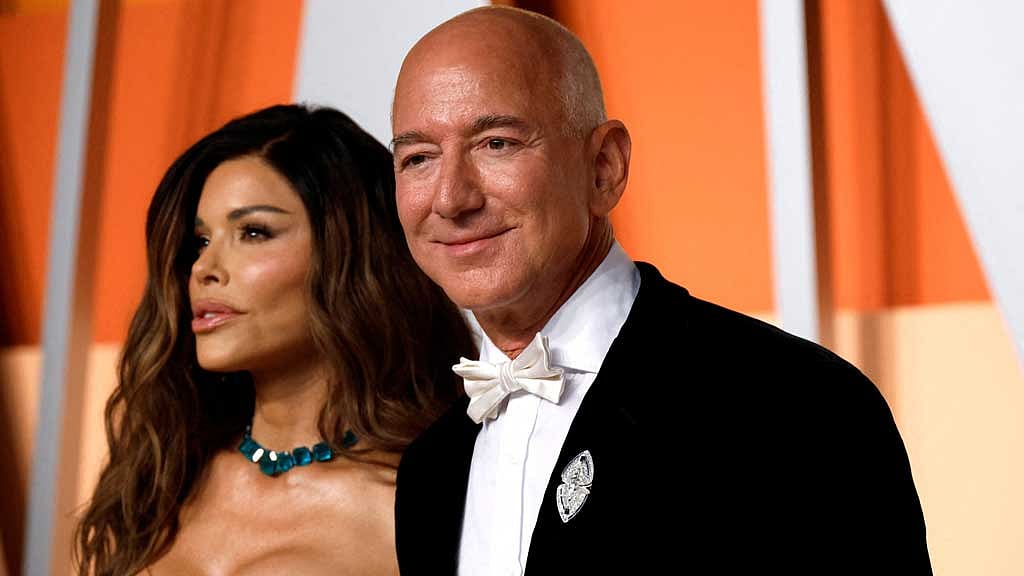 Lauren Sanchez and Jeff Bezos arrive at the Vanity Fair Oscars party after the 97th Academy Awards, in Beverly Hills, California, US, Mar 2, 2025. REUTERS