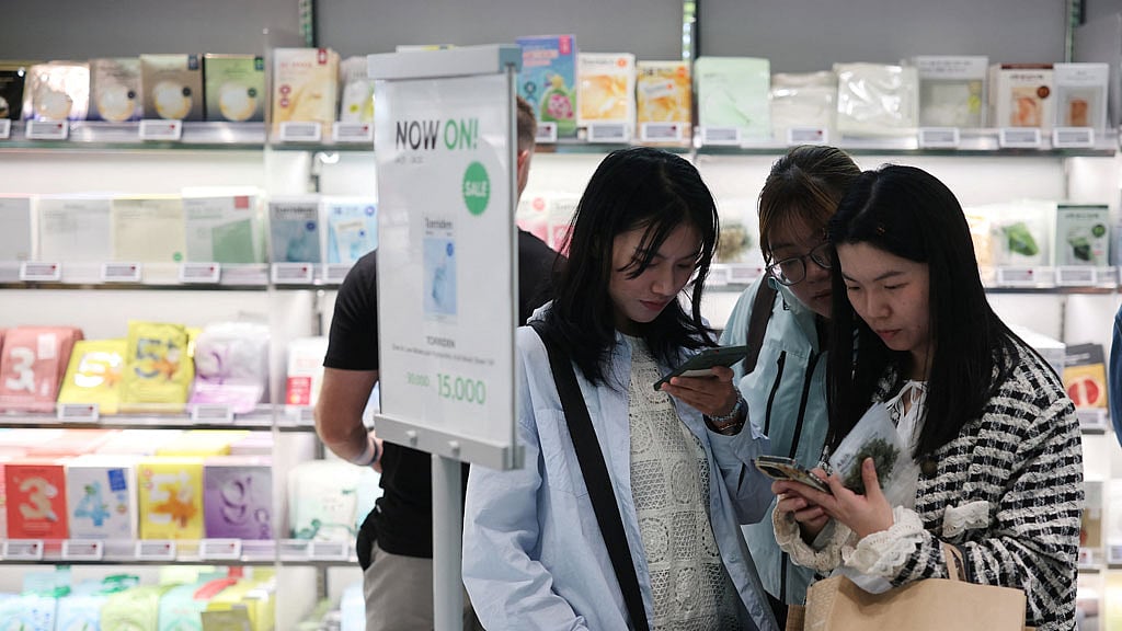 Foreign tourists shop at an Olive Young store in Seoul, South Korea, Apr 28, 2025. REUTERS/Kim Hong-Ji