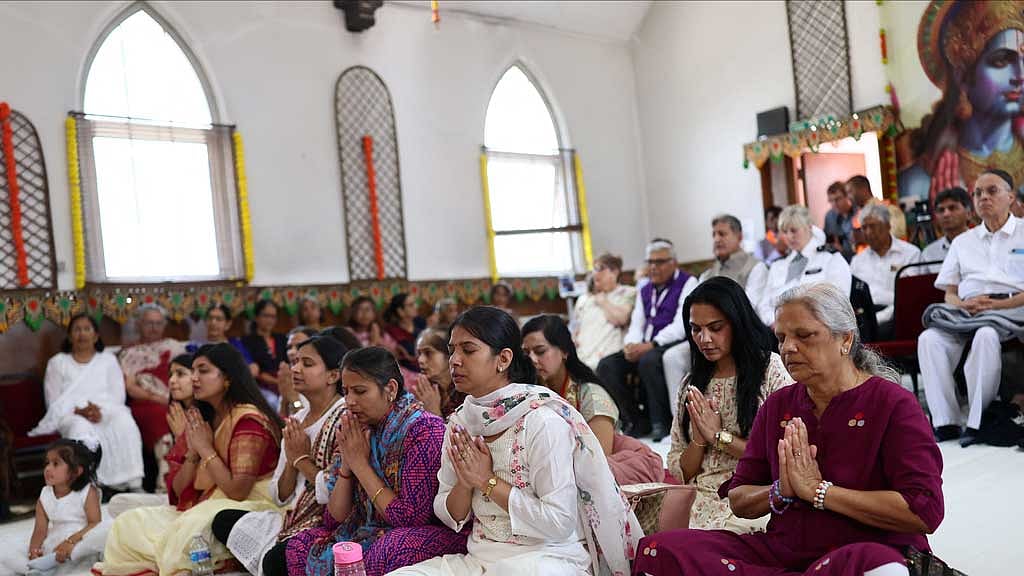 People pray during vigil at the International Siddhashram Shakti Centre in memory of those who have lost their lives in the Air India crash, in London, Britain, June 14, 2025. REUTERS