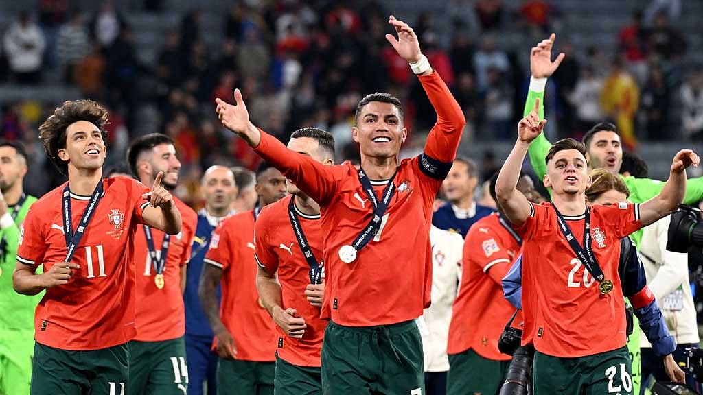 Nations League - Final - Portugal v Spain - Allianz Arena, Munich, Germany - Jun 8, 2025 Portugal's Cristiano Ronaldo, Francisco Conceicao and Joao Felix celebrate in front of the fans after winning the UEFA Nations League REUTERS/Angelika Warmuth