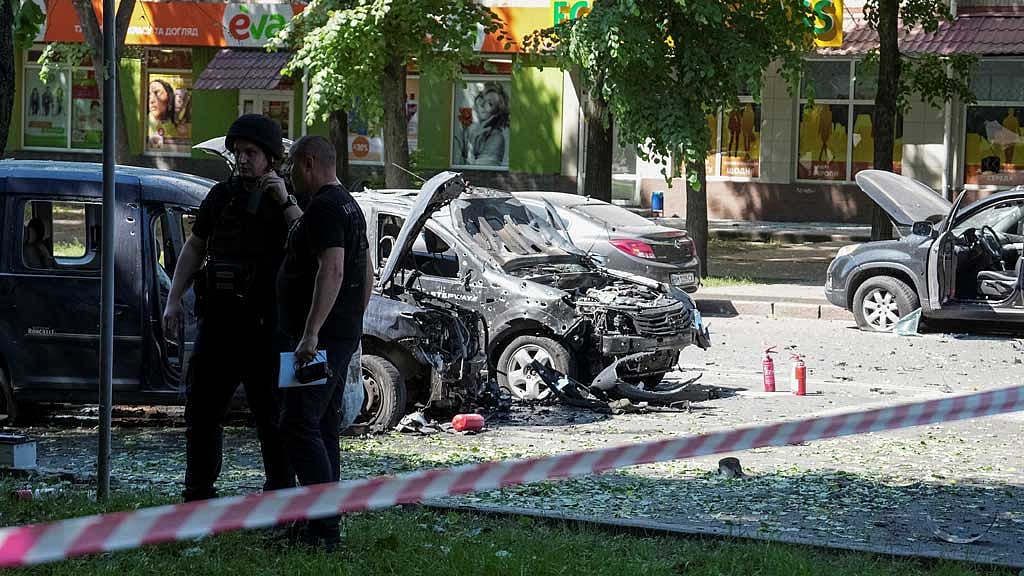 Police officers stand at the site of a Russian military strike, amid Russia's attack on Ukraine in Sumy, Jun 3, 2025. REUTERS