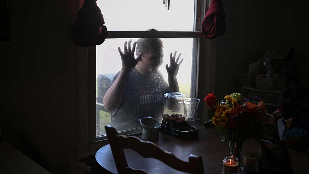 Austin Smith, 17, who uses Wegovy for weight loss, leans against a window while interacting with his family in Gladstone, Missouri, US, September 28, 2024. REUTERS