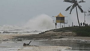 Cyclone Alfred downgraded as Australians stay indoors
