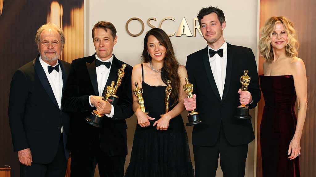 Director Sean Baker and producers Alex Coco and Samantha Quan pose with the Oscar for Best Picture for "Anora", Meg Ryan and Billy Crystal, in the Oscars photo room at the 97th Academy Awards in Hollywood, Los Angeles, California, US, Mar 2, 2025. REUTERS/Daniel Cole