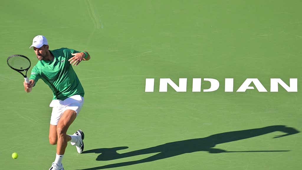 Mar 8, 2025; Indian Wells, CA, USA; Novak Djokovic (SRB) hits a shot against Botic Van De Zandschulp (not pictured) during the second round of the BNP Paribas Open at the Indian Well Tennis Garden. Credit: Jayne Kamin-Oncea-Imagn Images via Reuters