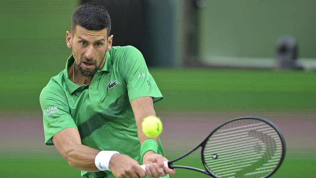 Mar 8, 2025; Indian Wells, CA, USA; Novak Djokovic (SRB) hits a shot against Botic Van De Zandschulp (not pictured) during the second round of the BNP Paribas Open at the Indian Well Tennis Garden. Credit: Jayne Kamin-Oncea-Imagn Images via Reuters