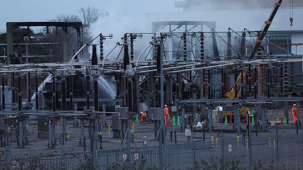People work at an electrical substation, after a fire there wiped out the power at Heathrow International Airport, in Hayes, London, Britain, Mar 21, 2025. REUTERS/Isabel Infantes