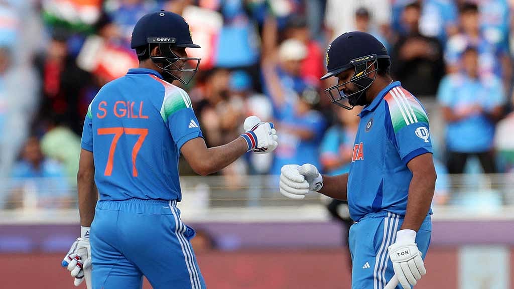ICC Men's Champions Trophy - Final - India v New Zealand - Dubai International Stadium, Dubai, United Arab Emirates - March 9, 2025 India's Shubman Gill and Rohit Sharma interact REUTERS/Satish Kumar