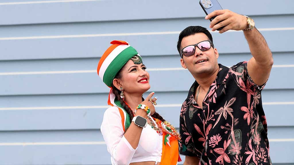 ICC Men's Champions Trophy - Final - India v New Zealand - Dubai International Stadium, Dubai, United Arab Emirates - March 9, 2025 India fans pose for a selfie before the match REUTERS/Satish Kumar