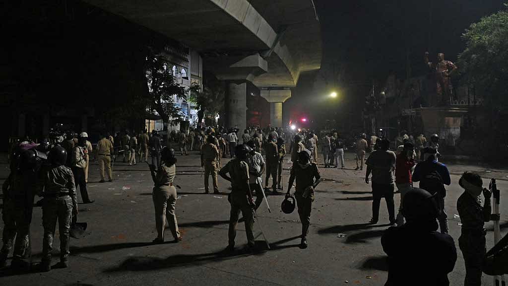 Members of police stand guard after clashes erupted due to demands over removal of the tomb of Mughal emperor Aurangzeb, in Nagpur, India, Mar 17, 2025. REUTERS/Stringer