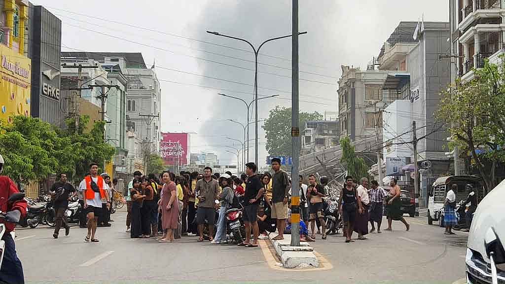 People gather on a street after a strong earthquake struck central Myanmar, in Mandalay, Myanmar, March 28, 2025. REUTERS
