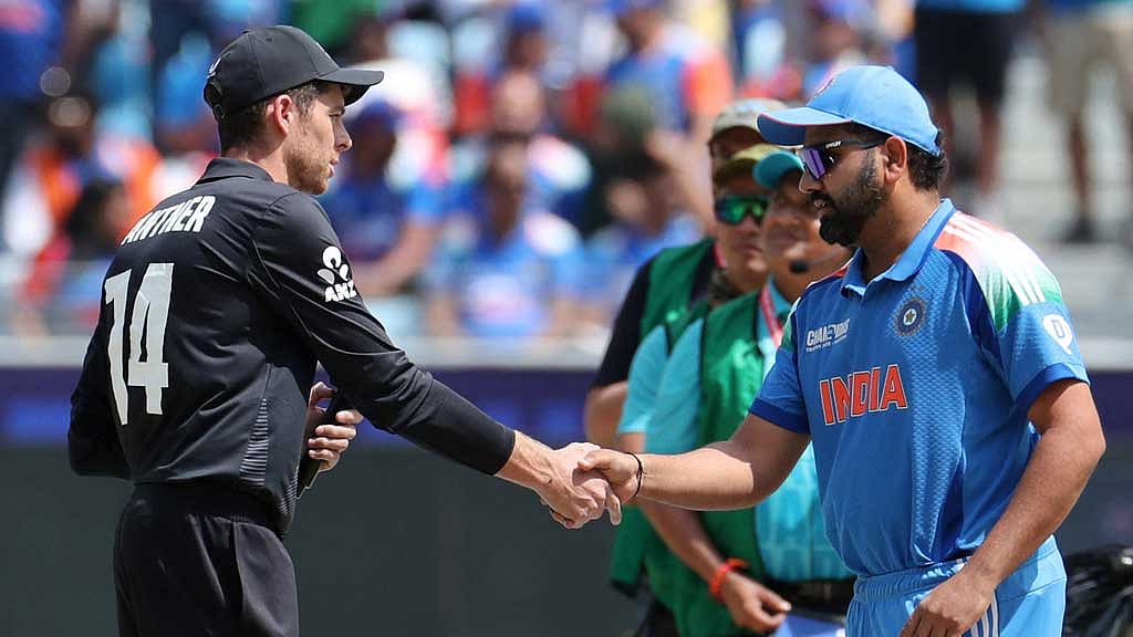 Cricket - ICC Men's Champions Trophy - Final - India v New Zealand - Dubai International Stadium, Dubai, United Arab Emirates - March 9, 2025 India's Rohit Sharma shakes hands with New Zealand's Mitchell Santner during the toss before the match REUTERS/Satish Kumar