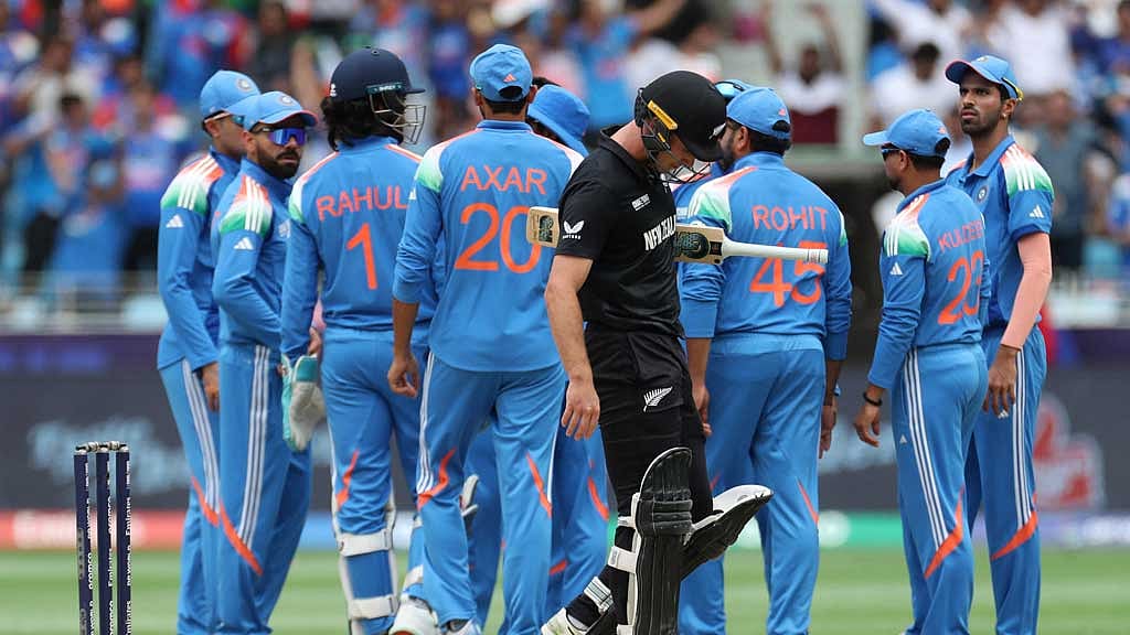 ICC Men's Champions Trophy - Final - India v New Zealand - Dubai International Stadium, Dubai, United Arab Emirates - March 9, 2025 New Zealand's Will Young looks dejected and walks back to the pavilion after losing his wicket, LBW bowled by India's Varun Chakravarthy REUTERS/Satish Kumar