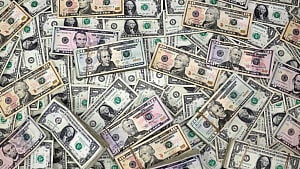 Dollar poised for third weekly gain