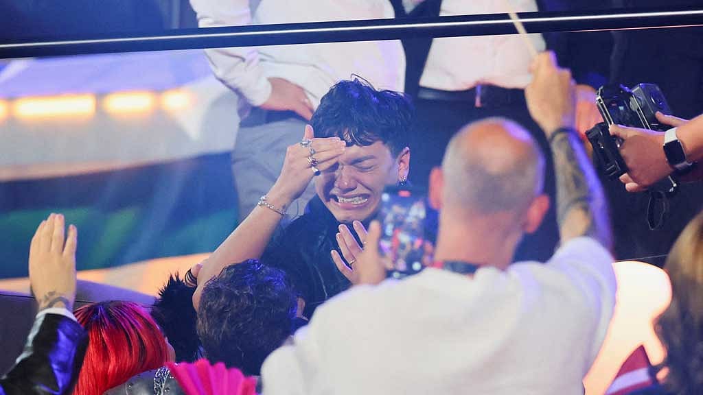 JJ, representing Austria, reacts after being announced as the winner during the Grand Final of the 2025 Eurovision Song Contest in Basel, Switzerland, May 18, 2025. REUTERS/Denis Balibouse