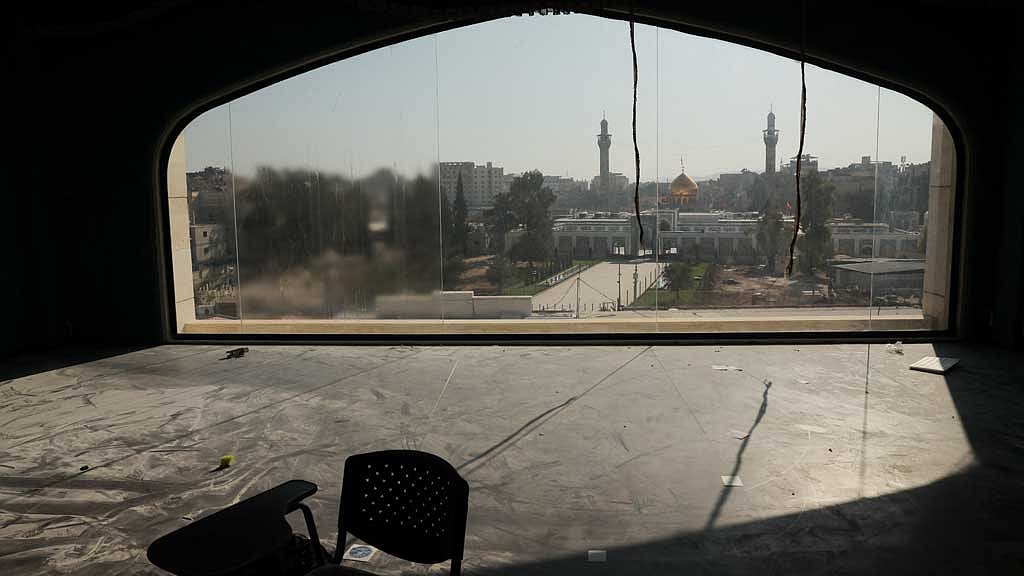 The Sayyida Zaynab shrine is visible through a window at a hotel used by Iranians under former Syrian President Bashar al-Assad's regime, in Damascus, Syria, December 14, 2024. REUTERS/Amr Alfiky