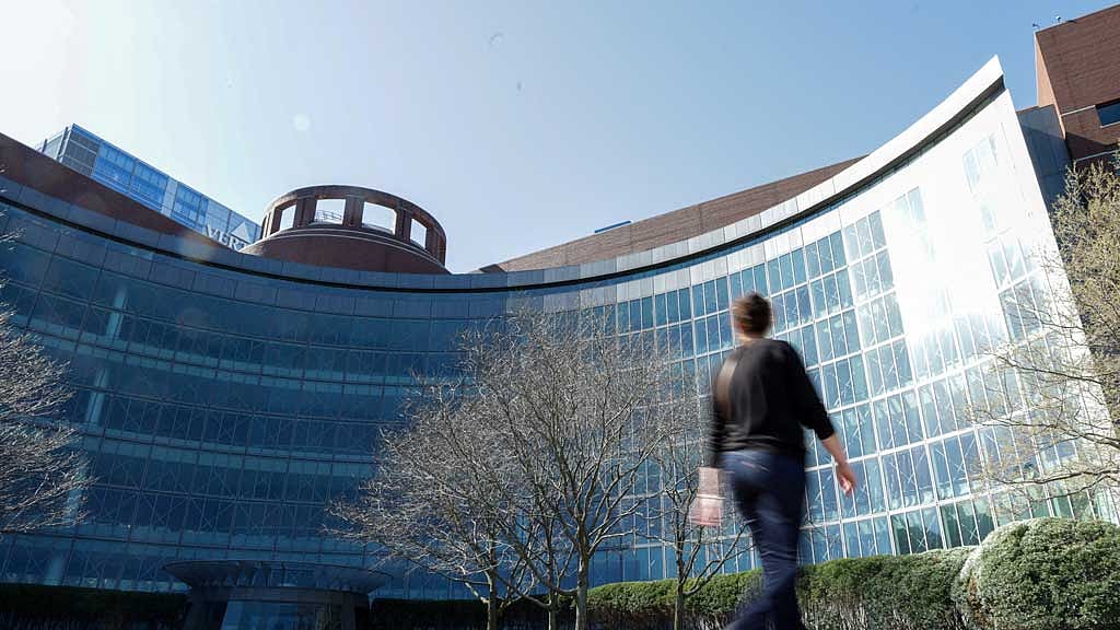 A person walks by the federal courthouse where a judge held an initial hearing in Harvard University's lawsuit seeking to block US President Donald Trump from freezing billions of dollars in federal funding, in Boston, Massachusetts, US, April 28, 2025. REUTERS