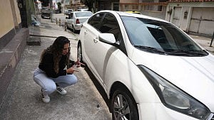 Wife of Brazil's police raid victim fights to clear his name