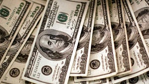Dollar steady as investors eye release of US data backlog